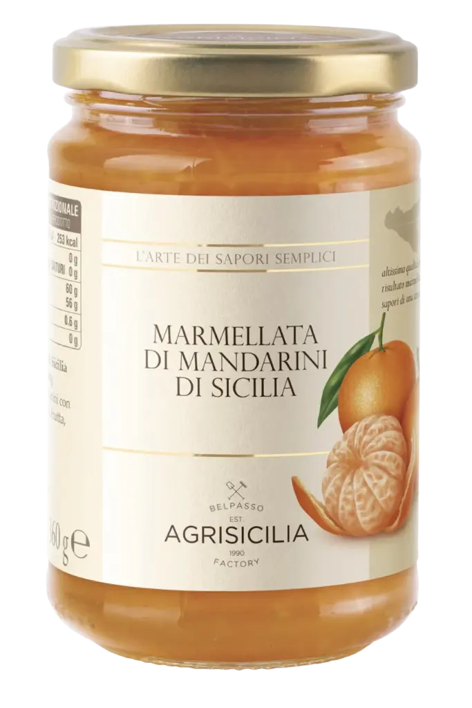 Glass jar with delicious Sicilian mandarin marmalade, made from fresh, high-quality fruit.